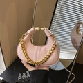 Chic pink patent leather dumpling bag with chunky gold chain strap and clasp closure - Pink