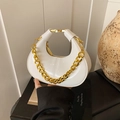Mini white patent leather crescent bag featuring a bold gold chain and top handle - White