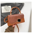 Detail of vintage brown crocodile embossed leather handbag with gold geometric buckles - Brown