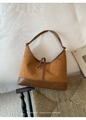 Detail of retro brown tote with suede finish and silver ring buckle accent - Brown