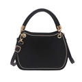 Minimalist black velvet handbag with golden circular hardware and adjustable strap - Black