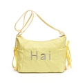 Light yellow canvas crossbody bag with Hai print and yellow ribbon bow details - Yellow