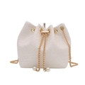 White corduroy drawstring bucket bag with gold chain strap and elegant pearl charm - White