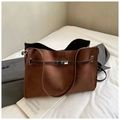 Detail of dark brown suede tote bag with silver twist-lock and decorative straps - Coffee without Pendant
