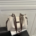 Minimalist off-white large capacity tote bag with dark brown straps and sleek leather tag - White