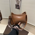 Brown vintage half-moon leather shoulder bag with stylish wide geometric fabric strap - Tan