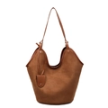 Minimalist caramel brown suede tote bag featuring a spacious design and smooth leather straps - Tan