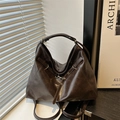 Retro dark brown leather hobo bag with adjustable straps and metal hook hardware - Brown