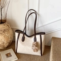 Chic cream tote bag with brown trim and cute plush bear accessory in a retro setting - Off-White (With Pendant)
