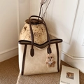 Minimalist cream tote bag with dark brown trim and a plush bear charm for daily commute - With Pendant / Off White