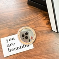 Detail of round magnetic makeup mirror with Gift For You design on wooden table - Orange (Magnetic Base-gift Mirror)