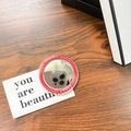 Close-up of a round magnetic makeup mirror with a red Gift For You border on a wood table - Red (Magnetic Base-gift Mirror)
