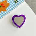 Detail view of heart-shaped purple mirror phone socket with clear expandable base - Dark Purple
