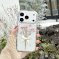 Detailed view of iPhone case with pink dried flowers, white bowknot, and silver glitter - Real Flower Epoxy - Pink / iPhone 17 Pro Max
