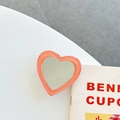 Dettaglio del supporto per telefono a specchio a forma di cuore arancione corallo - Supporto Trasparente-Specchio a Cuore con Bordo Jelly-Arancione