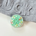 Close-up of a green resin button phone socket with fruit slices and a gift card background - Magnetic Pearly Fruit Button - Dark Green