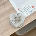 Detailed view of heart phone grip with pearl finish and silver bow with crystals - (White Diamond) Magnetic Shell Heart - #8 Sweet Cool Butterfly
