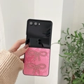 Detail of pink snakeskin leather phone case with sparkling rhinestone butterfly accents - Rose Red Snakeskin Rhinestone Butterfly