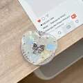 Macro view of heart-shaped phone grip with iridescent surface and silver bow accent - (White Diamond) Magnetic Shell Heart - #10 Black Diamond Butterfly