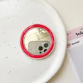 Detail eines roten magnetischen Kreisspiegels mit Good Luck Text auf Keramiktablett - Rosenrot