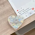 Herzförmige Handyhalterung mit Perlmutt-Textur, Kristallen und Saturn-Ring-Logo - Transparenter Ständer - Muschelherz Planet - #11