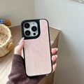 Macro detail of pink wrinkled leather texture on iPhone Pro case with black frame - Pearlescent Pink / iPhone 17 Pro Max