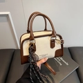 Brown and beige contrast boston handbag with elegant woven pendant and brand lettering - White and Coffee with Pendant