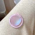 Detailed view of pink iridescent strawberry phone grip on soft knitted background - Iridescent Strawberry-Pink