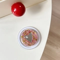 Macro view of round glitter phone grip with pink sequins and heart mirror detail - Magnetic Sequin Heart Mirror Style 12