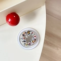 Macro shot of circular phone grip featuring colorful sequins and mine. heart motif - Magnetic Sequin Heart Mirror Style 2