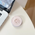 Nahaufnahme eines rosa Glitzer-Button-Handyhalters auf einem weißen Tisch mit Laptop - Magnetisch-Perlmutt Großer Knopf / Rosa