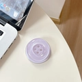 Close-up of a purple glitter button-shaped phone socket on a white desk workspace - Magnetic-Pearly Big Button / Purple