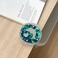 Detail of green marble phone grip featuring a silver dolphin heart and rhinestones - Rendered Block Dolphin Mirror / Dark Green