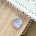 Macro detail of a colorful gradient resin strawberry phone grip with a translucent finish - Iridescent Purple
