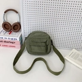 Forest green corduroy crossbody bag with adjustable strap in a lifestyle campus aesthetic - Green