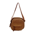 Brown corduroy crossbody bag with adjustable strap and front pocket in 45-degree view - Brown