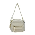 Minimalist beige corduroy crossbody bag featuring a front pocket and decorative tassels - White