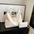 White woven tote bag set with matching inner pouch on a modern shelf display - White
