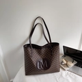 Brown tote bag with all-over M-pattern and embossed logo for daily commuting - Brown