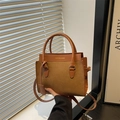 Minimalist brown suede and leather patchwork crossbody bag with gold FASHION & BAGS logo - Tan