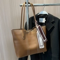 Brown leather tote bag with white contrast stitching and a decorative fashion scarf - Brown