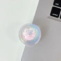 Macro shot of iridescent round phone grip with pink glitter accent on office desk - Crystal Ball Stand - Dreamy Bubble - No. 17