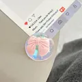 Close-up of clear resin phone socket featuring a 3D pink bow with iridescent finish - Dreamy Bubble Crystal Ball Style (99)