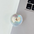 Macro shot of iridescent phone grip with white bow and sparkling gemstone detail - Crystal Ball Stand - Dreamy Bubble - No. 24