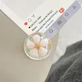 Detailed macro view of a clear resin phone socket with an embedded white pearl flower - Dreamy Bubble Crystal Ball Style (92)