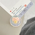Iridescent phone grip with 3D pink bow and yellow bell inside a clear resin circle - Dreamy Bubble Crystal Ball Style (95)