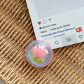 Close-up of iridescent resin phone grip featuring an 3D pink tulip and green stem inlay - Dreamy Bubble No. 104
