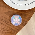 Close-up of a floral bear sequin pop socket on a white ceramic tray and wood desk - Dreamy Bubble No. 30