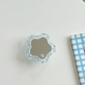 Close-up of a floral rhinestone phone socket featuring blue glitter and a small mirror - Transparent Glitter Flower Mirror - Blue