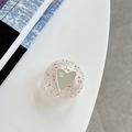 Close-up of heart-shaped glitter phone grip tok with mirror surface and mine text - Adhesive Sequin Heart Mirror - Glitter Red
